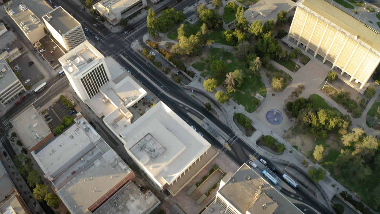 Aerial Drone Footage of a Cityscape with Buildings, Streets, and a Park