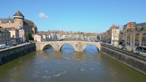 old bridge crossing mayenne river with laval castle