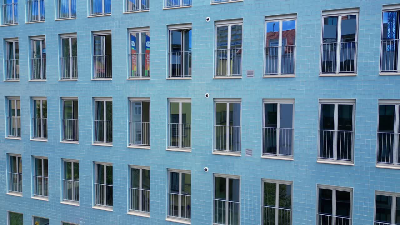 Aerial view of the facade of a modern building with the windows reflecting like mirrors in Lisbon,Portugal