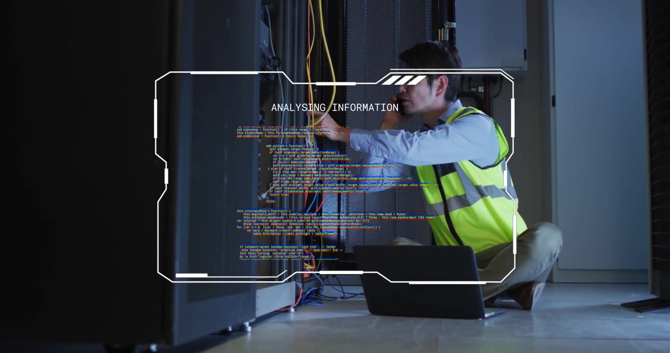 Male tech kneeling at open cabinet, receiving phone call fixing network cables with HUD guiding fix