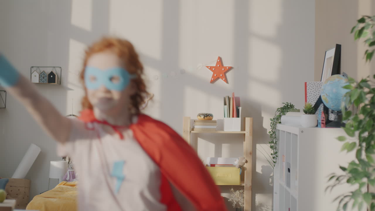 Child Superhero Playing in Bedroom