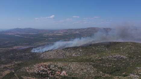 bushfire in the mountain hills at summer in croatia