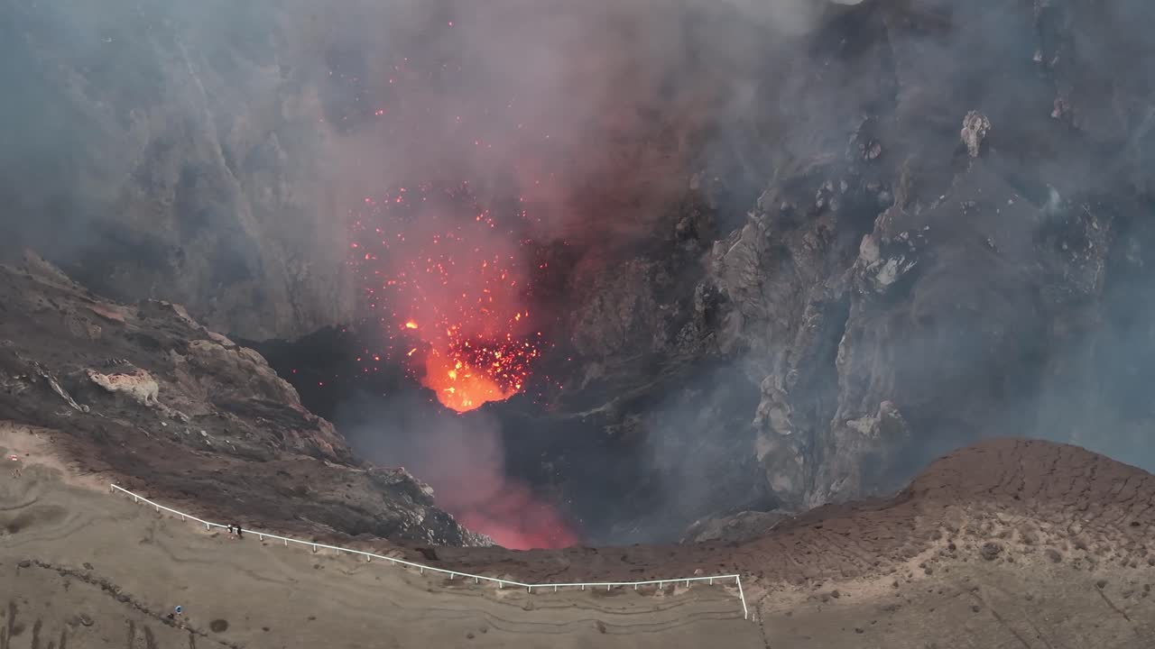 Small eruption of Mount Yasur Active Volcano in Vanuatu. Aerial over crater rim, nature wonder.