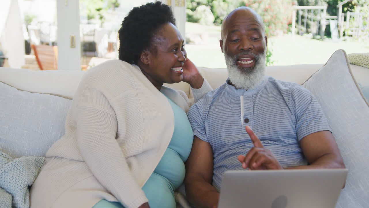 Happy senior african american couple smiling