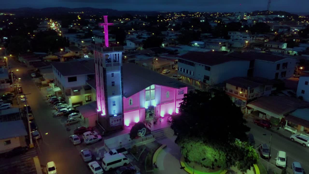 Christian Church Building Lit Up at Night in Chorrera City, Aerial Drone