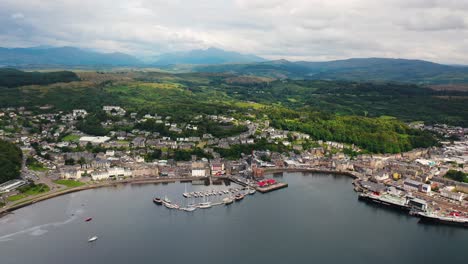 aerial view over oban bay in scotland with boats in the harbour