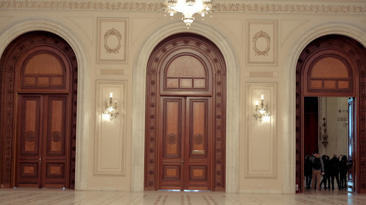 Bucharest, Romania - December 17, 2021: People walking on the inside of the Palace of Parliament