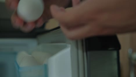 close-up shot of eggs being stored in a refrigerator tray.