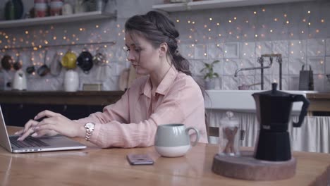 woman working from home in kitchen