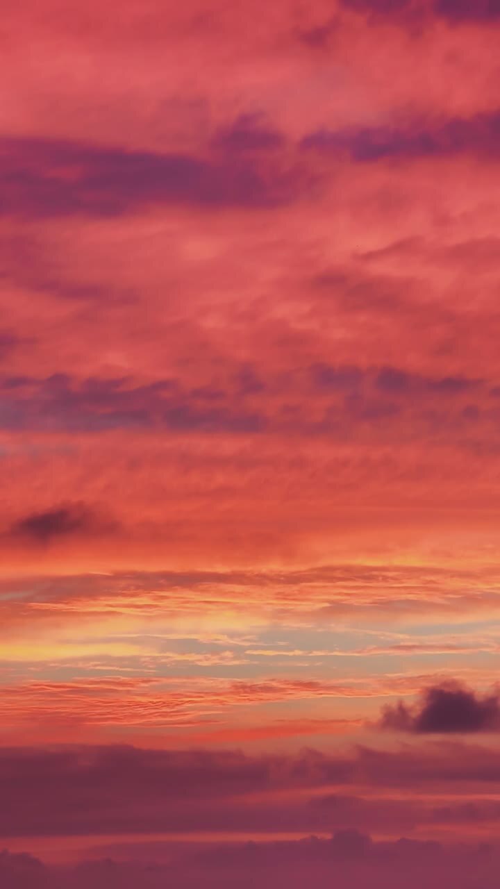 Stunning sunset sky filled with shades of purple, orange and blue, creating a beautiful and serene cloudscape