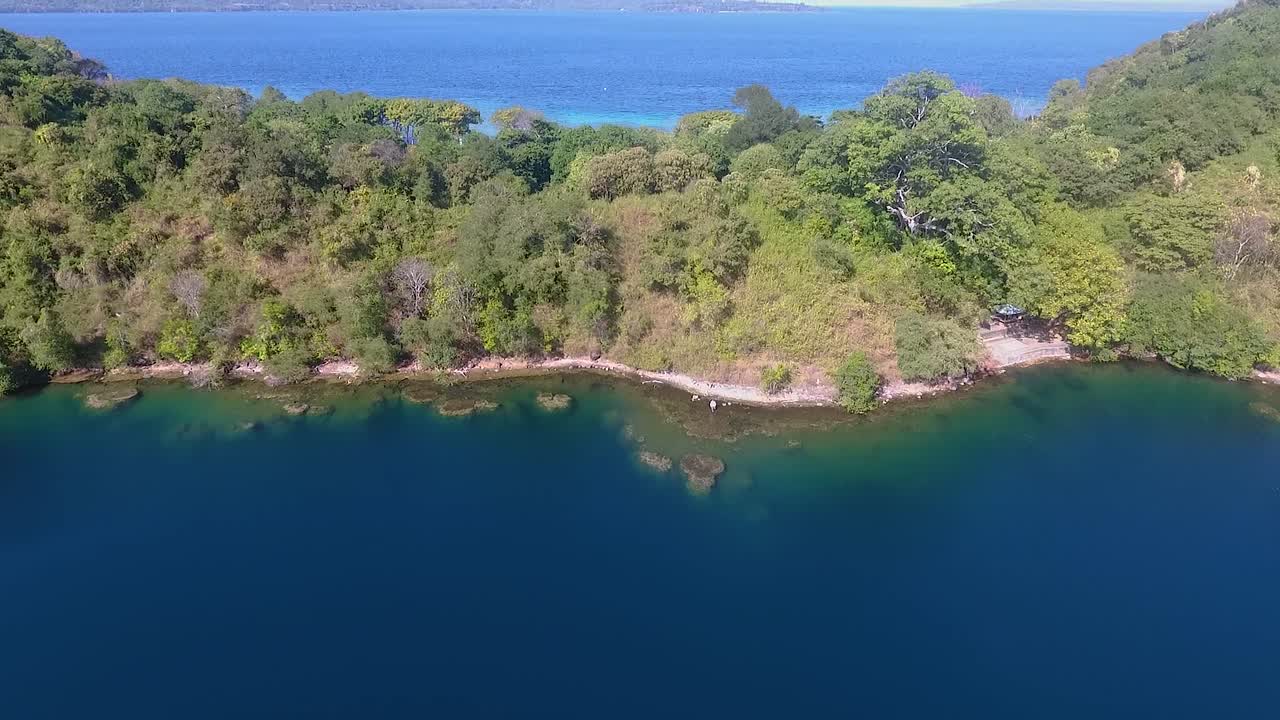 Aerial view of Satonda Island with volcanic crater lake in Sumbawa, Indonesia