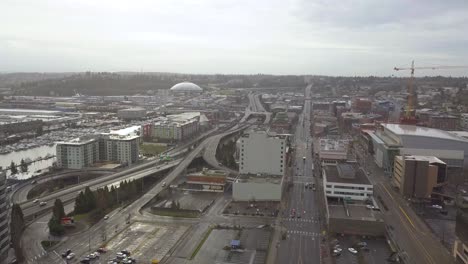 Aerial-View-Of-Freeway-And-Buildings-In-Downtown-Tacoma,-Washington-On-An-Early-Morning---drone-shot