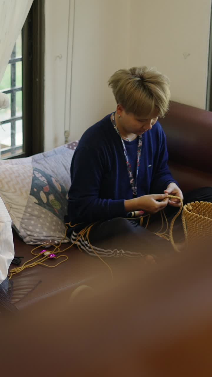 People sitting indoors near a window