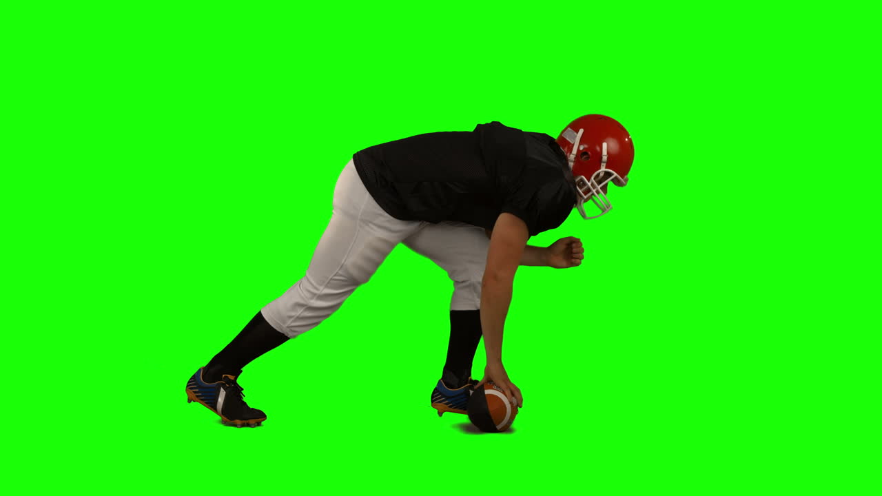 Giocatore di football americano su green screen