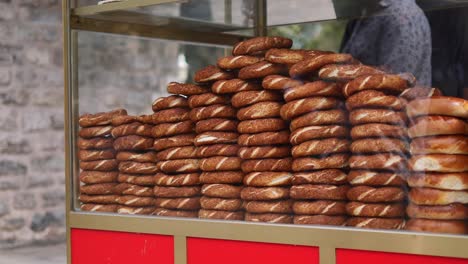 a vendor sells simite bread on the street in istanbul, turkey