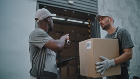 delivery and logistics team handling packages at a warehouse