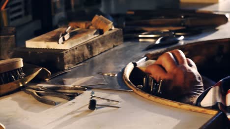 Goldsmith-working-in-workshop