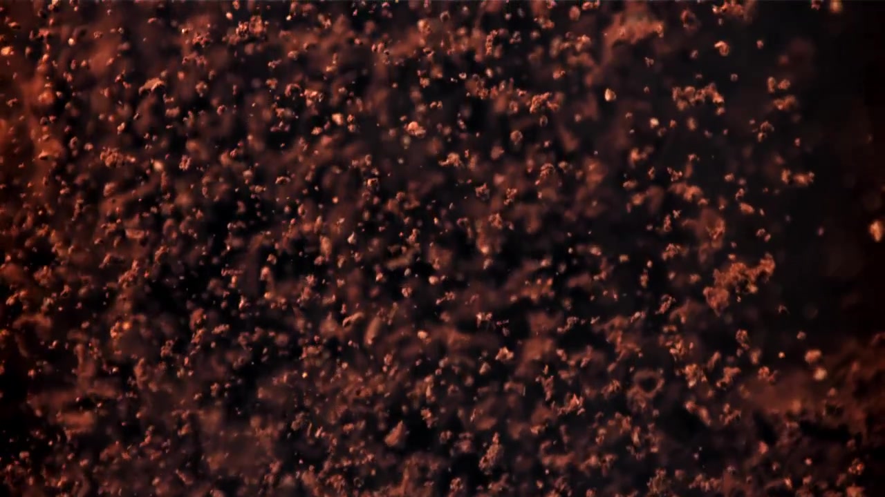 Partículas Abstratas Marrom-Avermelhadas Flutuando para Cima em um Fundo Escuro