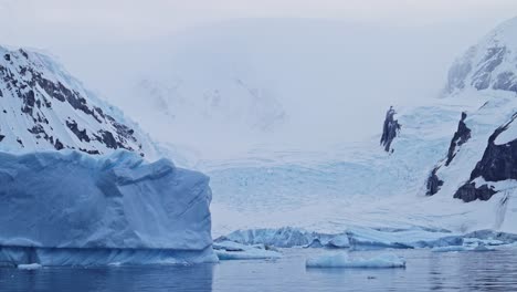 Antarctica-Iceberg-Mountains-and-Ocean,-Beautiful-Dramatic-Blue-Coastal-Landscape-and-Seascape-on-Antarctic-Peninsula-Coast,-Icy-Winter-Sea-Scene-with-Ice