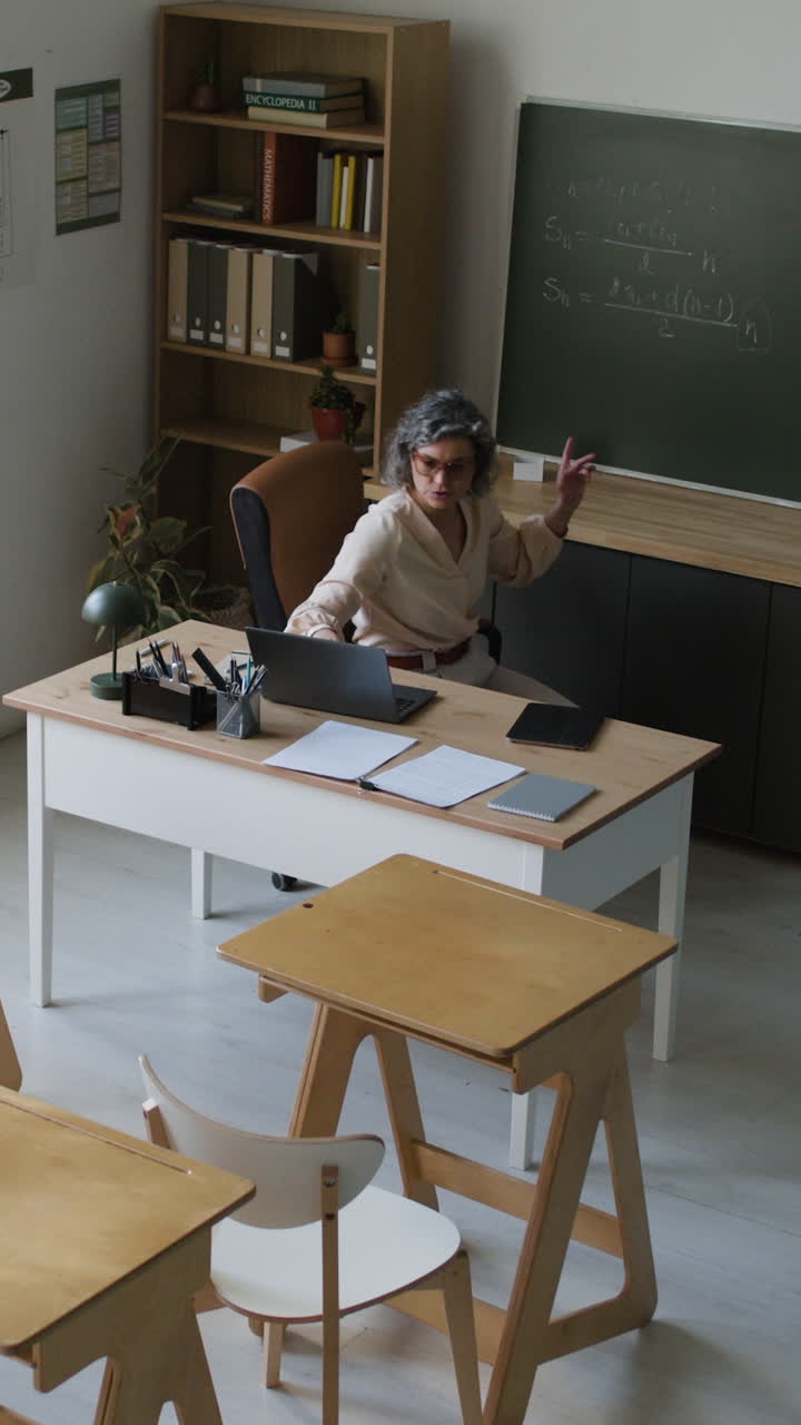 Teacher explaining math in classroom