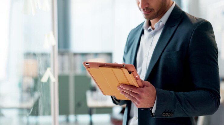 Tablet, planning and business man writing
