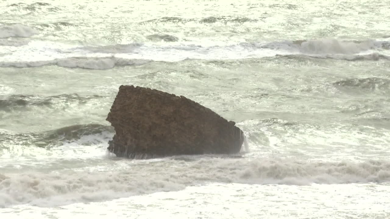 Powerful Waves Crashing on Rocks at the Coastline