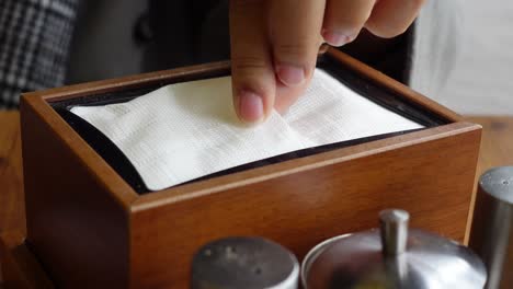 wooden napkin holder on a table