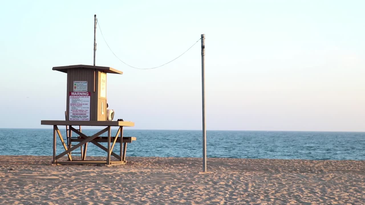 Newport beach lifeguard tower on an empty beach.