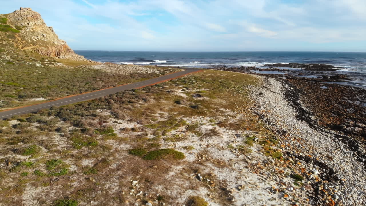 Scenic Coastal Road with Rocky Coastline