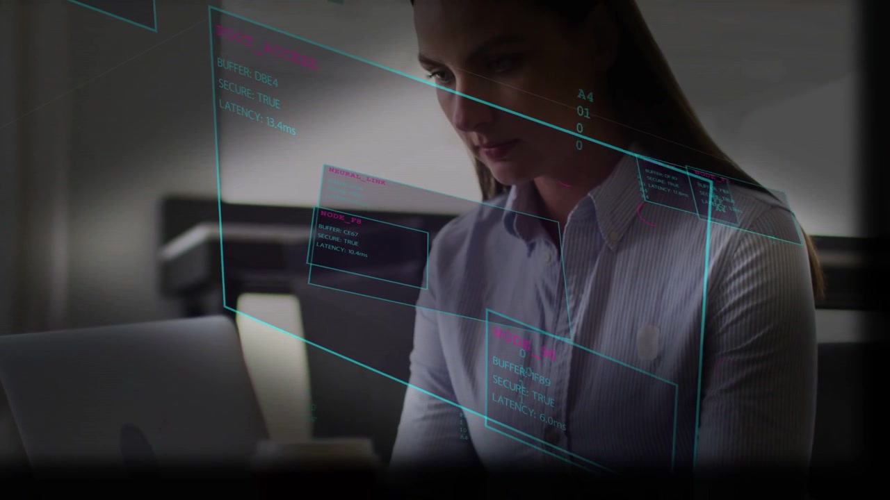 Typing woman wearing shirt leaning and scanning screen at cafe, silver laptop red cup teal UI