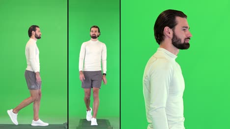 man in sports wear walking on a green screen, chroma key