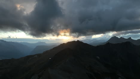 Close-aerial-flight-over-a-rocky-mountain-crest-french-alps-summer-day