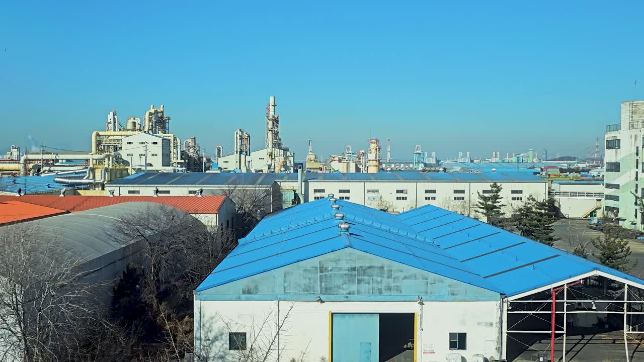 Industrial Complex At Port Of Incheon On Wolmi Island In South Korea. elevated trucking shot