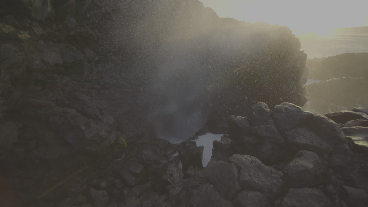 Powerful Ocean Waves Crashing Against Volcanic Rocks