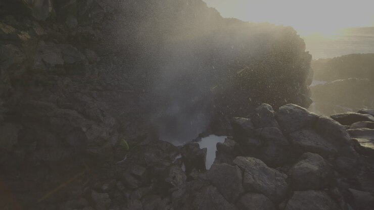 Powerful Ocean Waves Crashing Against Volcanic Rocks