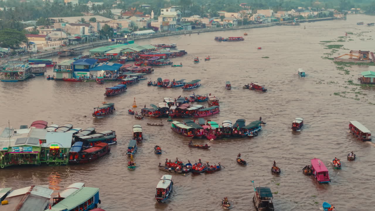Aerial View of a Busy River with Floating Boats and People