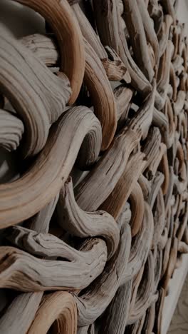 abstract wall art made from interwoven driftwood pieces