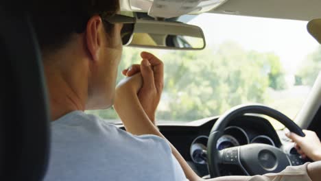 couple together in a car on road trip