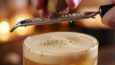 making a festive cocktail with a grater