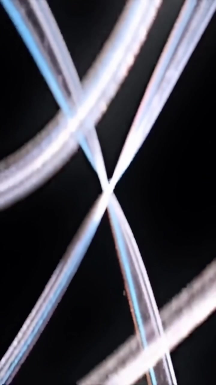 Abstract Light Trails Moving Against a Black Background