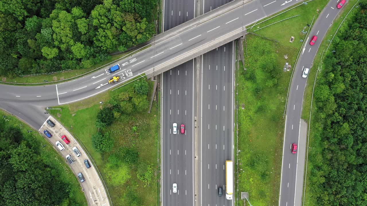 Birdseye drone aerial view static the motorway over a busy junction
