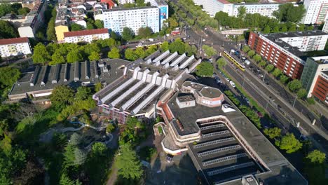 urban landscape of Berlin Friedrichshain, featuring the abandoned Sez a historical Gdr indoor swimming pool. Nice aerial view flight drone camera pointing down