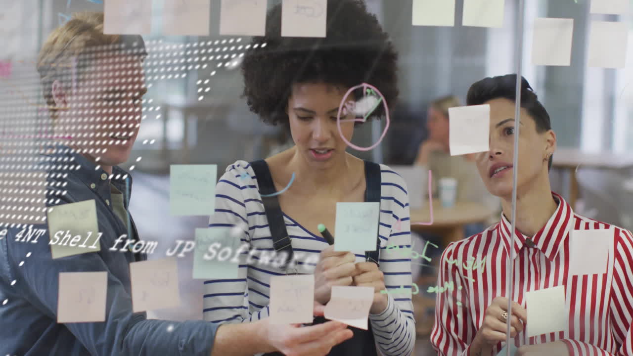 Brainstorming with sticky notes and digital data overlay, diverse team collaborating