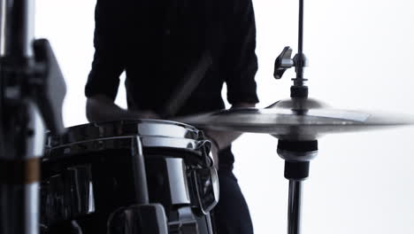 close up of drummer playing drum kit in studio shot on r3d