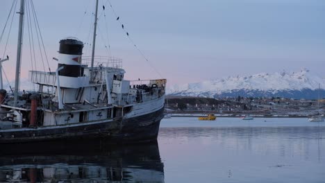 LOCKED-OFF-HMS-Justice-tug-boat-bow-sits-partially-aground-at-low-tide-in-the-Beagle-Channel