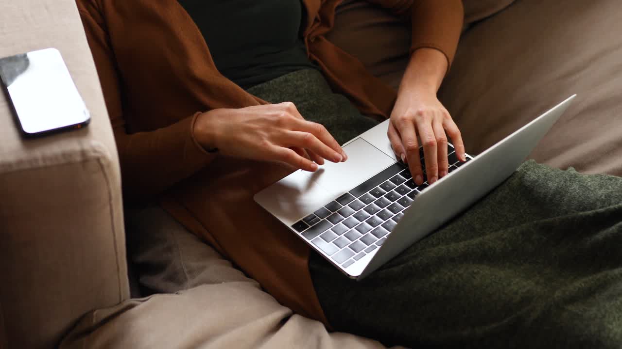 Caucasian woman using a laptop at home