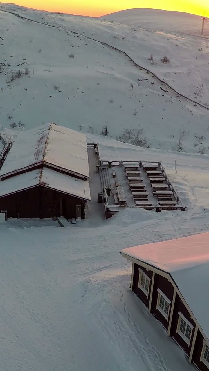 Snowy Mountain Scene with Buildings
