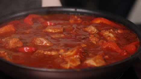 cooking pork stew in a pan