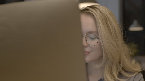 close up of a beautiful blonde woman working in the office