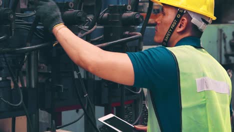 smart factory worker using machine in factory workshop